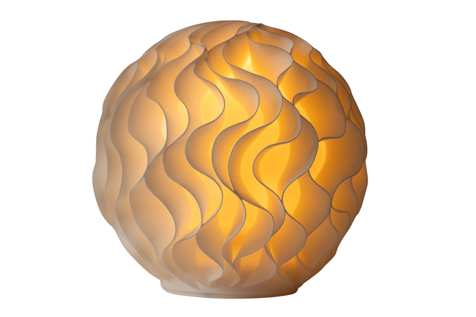 A 3D printed Growth lamp with the light on: white ruffled fins glowing warm around the light inside.